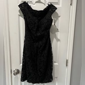 Never worn! Black lace formal fitted cocktail dress with beaded neckline. Sz 12